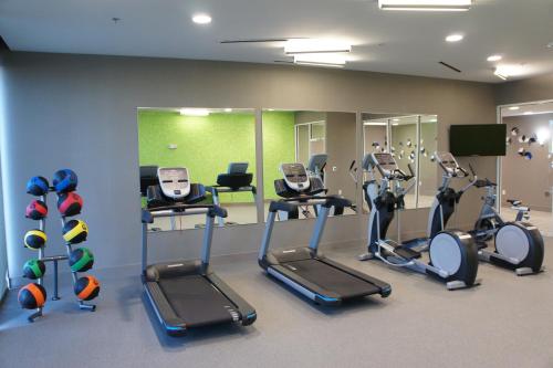 a gym with treadmills and ellipticals in a room at La Quinta Inn & Suites by Wyndham Braselton in Braselton