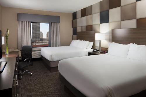 a hotel room with two beds and a window at Holiday Inn Express & Suites Oklahoma City Downtown - Bricktown by IHG in Oklahoma City