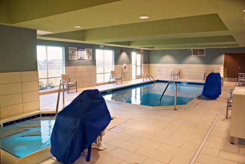 a large swimming pool in a hospital at Holiday Inn Express & Suites - Rantoul by IHG in Rantoul
