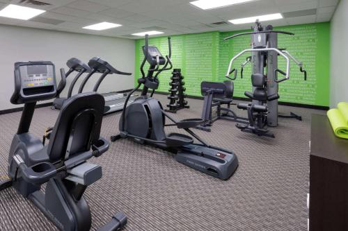 a gym with several tread machines in a room at La Quinta by Wyndham Minneapolis Bloomington W - FREE AIRPORT SHUTTLE in Bloomington