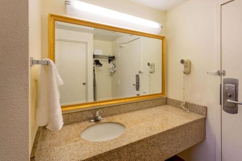 a bathroom with a sink and a mirror at La Quinta Inn by Wyndham Minneapolis Airport Bloomington in Bloomington