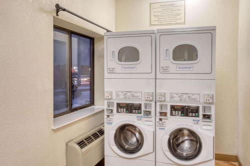 two washing machines in a room with a window at La Quinta Inn by Wyndham Minneapolis Airport Bloomington in Bloomington