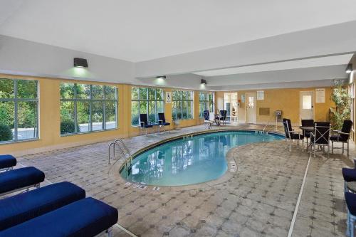 a large swimming pool in a hotel room at Holiday Inn Express Hotel & Suites - Concord by IHG in Kannapolis