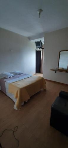 Ένα ή περισσότερα κρεβάτια σε δωμάτιο στο Hotel Pousada Icaraí