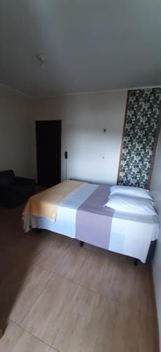 Ένα ή περισσότερα κρεβάτια σε δωμάτιο στο Hotel Pousada Icaraí