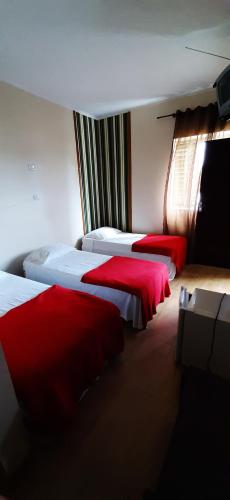 Ένα ή περισσότερα κρεβάτια σε δωμάτιο στο Hotel Pousada Icaraí