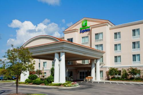 a hotel building with a sign on it at Holiday Inn Express Hotel & Suites - Concord by IHG in Kannapolis