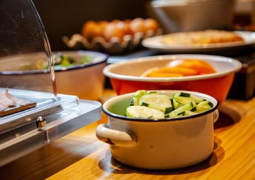 a pot with vegetables in it on a table at Sixties Ramblas in Barcelona