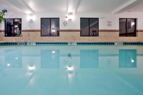 a swimming pool with lights in the water at Holiday Inn Express & Suites Exmore - Eastern Shore by IHG in Exmore