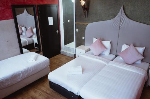 Postel nebo postele na pokoji v ubytování Hotel Le Centenaire Brussels Expo