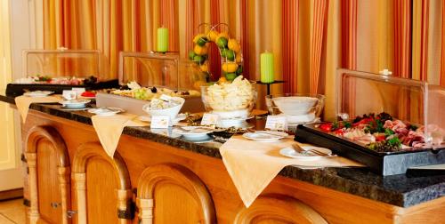 a table with food on top of it at Bodensee-Hotel Kreuz in Uhldingen-Mühlhofen