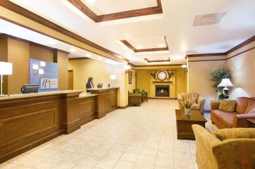 a lobby of a hospital with a woman in a waiting room at Holiday Inn Express Hotel & Suites Mattoon by IHG in Mattoon