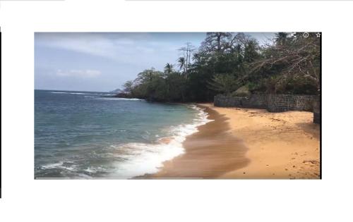 a picture of a beach with the ocean at Domus Guesthouse in Santana
