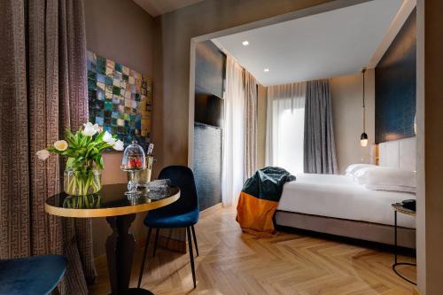 A bed or beds in a room at Dharma Boutique Hotel & SPA