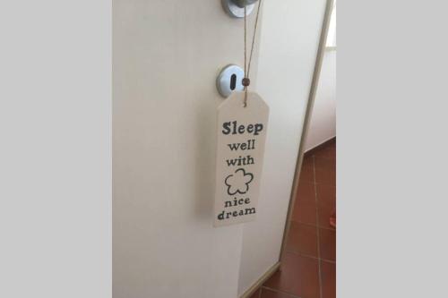 a sign hanging from a wall in a bathroom at Casa Pierina in Anacapri