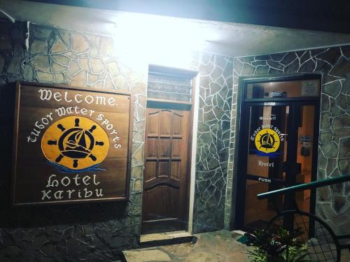 a welcome sign in front of a hotel door at Tudor Water Sports Hotel in Mombasa