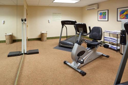 a gym with a treadmill and a exercise bike at Holiday Inn Express Hotel & Suites Freeport by IHG in Freeport
