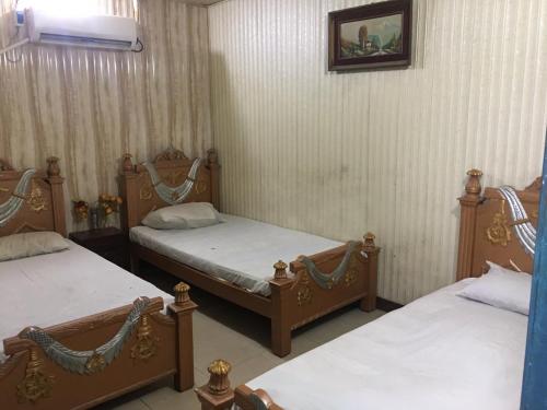 Cama o camas de una habitación en Haidery International Hotel