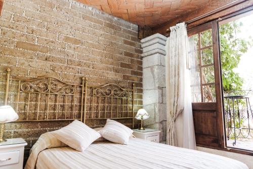 Кровать или кровати в номере Na-anché Hotel