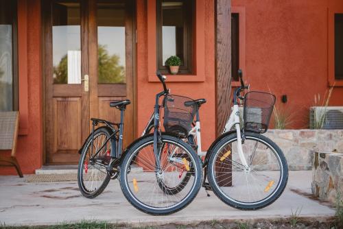 a couple of bikes parked outside of a house at El Legado Wine Lodge in Carmelo