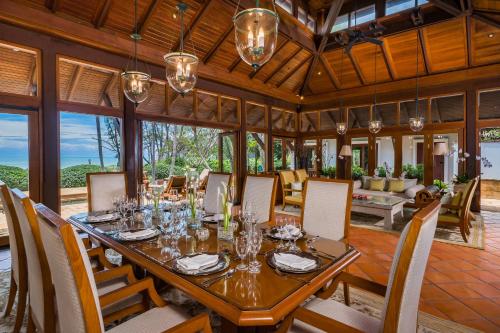 a dining room with a table and chairs at JW Marriott Phuket Resort and Spa in Mai Khao Beach