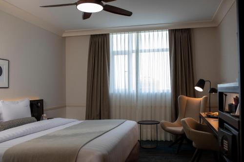a hotel room with a bed and a window at Casa Andina Premium San Isidro in Lima