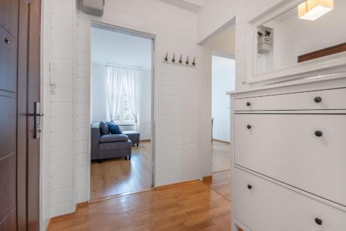 a kitchen with a door leading to a living room at CITYSTAY Plac Walowy Gdansk in Gdańsk