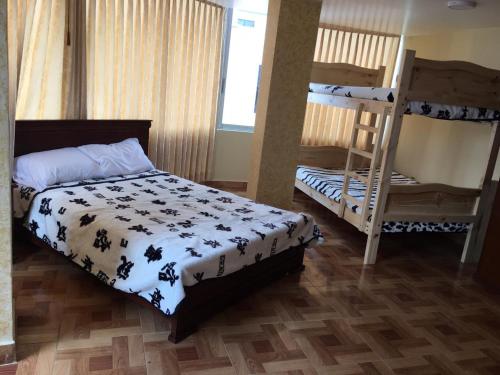 Postel nebo postele na pokoji v ubytování Hotel de la Peña