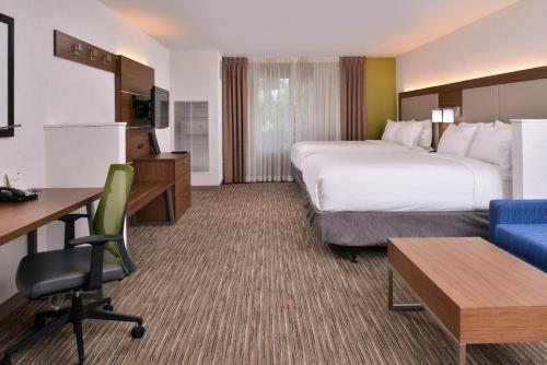 a hotel room with two beds and a desk at Holiday Inn Express & Suites Lacey - Olympia by IHG in Lacey