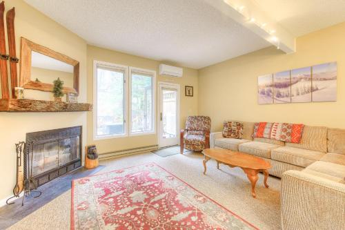 a living room with a couch and a fireplace at Leinemann Ski Haus in McHenry