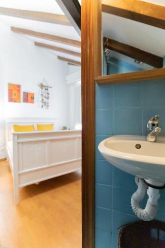 a bathroom with a sink in a room at Red House- Historic center in Porto