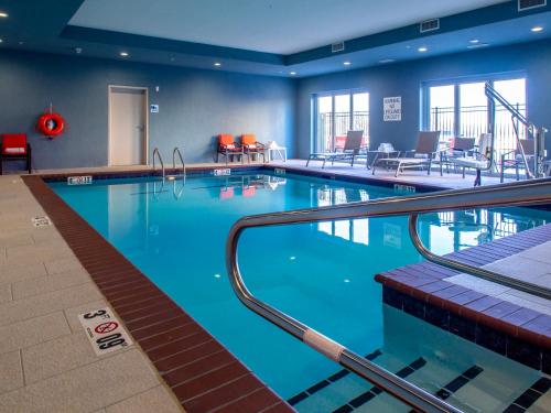 a large swimming pool in a hotel room at Holiday Inn Express & Suites - Oklahoma City Airport by IHG in Oklahoma City