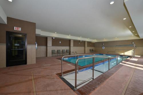 a large swimming pool in a large building at Holiday Inn Express Alva, an IHG Hotel in Alva