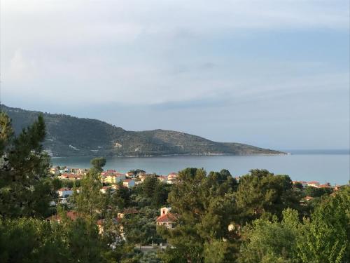 a view of a town and a body of water at Dimitra Beach Apartments - Thassos Skala Potamias in Skala Potamias