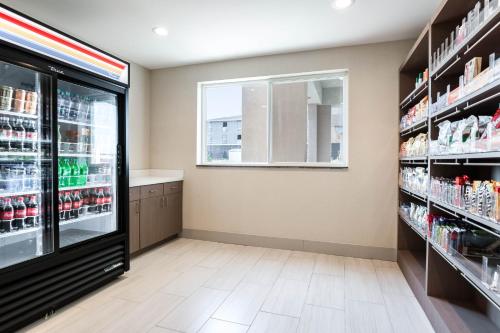 a pharmacy aisle with a window in a store at Holiday Inn Express Hotel & Suites Jasper by IHG in Jasper