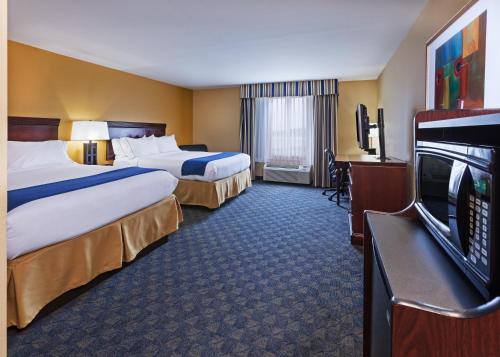 a hotel room with two beds and a flat screen tv at Holiday Inn Express & Suites, Corpus Christi NW, Calallen, an IHG Hotel in Corpus Christi