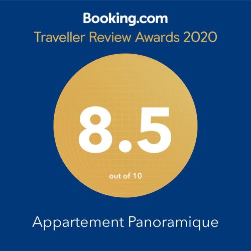 a yellow circle with the number eight and the text travelling review awards at Appartement Panoramique in Casablanca