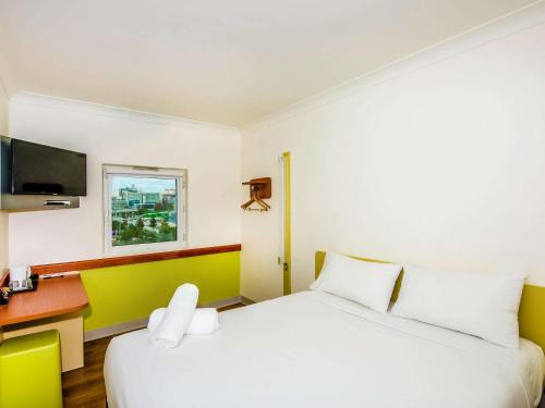 Postel nebo postele na pokoji v ubytování Imperial Motel Windsor