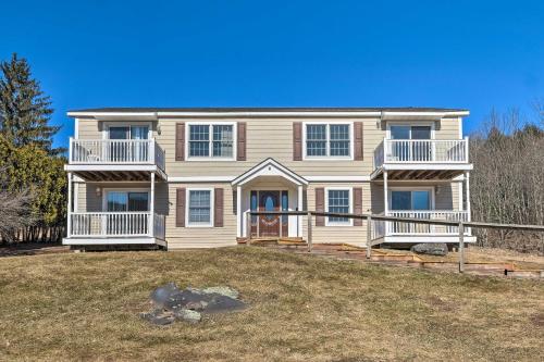 a house with a large yard in front of it at Cozy Catskill Condo - 2 Mi to Windham Mountain Ski in Windham