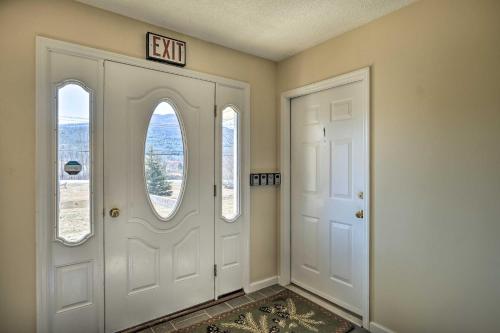 an exit sign above a door in a hallway at Cozy Catskill Condo - 2 Mi to Windham Mountain Ski in Windham