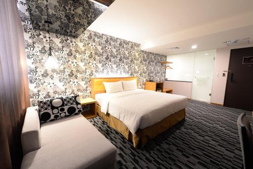 Postel nebo postele na pokoji v ubytování Bamboo Hotel