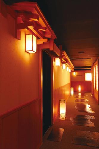 a row of lights on the side of a building at Matsui Honkan in Kyoto