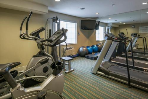 a fitness room with treadmills and exercise machines at Holiday Inn Express Hotel & Suites Livermore, an IHG Hotel in Livermore