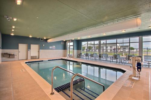 a large swimming pool in a large building at Holiday Inn Express & Suites Fond Du Lac, an IHG Hotel in Fond du Lac