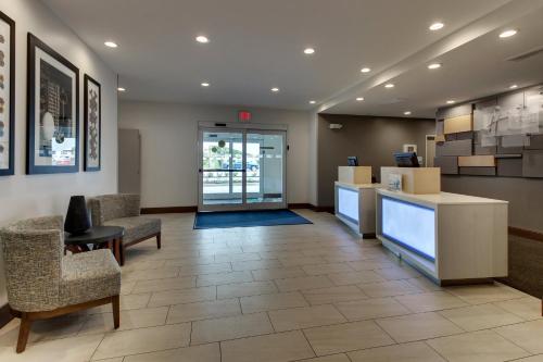a lobby of a hospital with chairs and a waiting room at Holiday Inn Express & Suites Ithaca by IHG in Ithaca