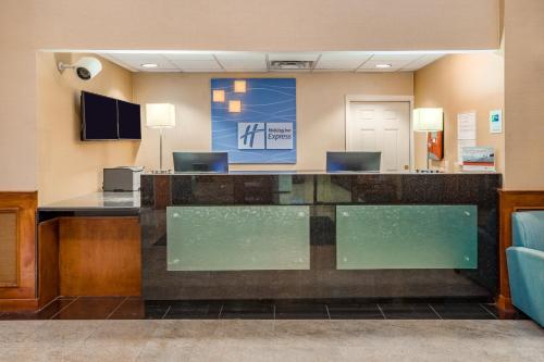 a lobby with a reception desk in a hospital at Holiday Inn Express Hotel & Suites Canton by IHG in Canton