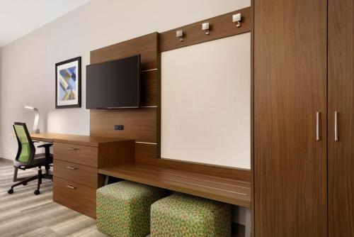 an office cubicle with a desk and a chair at Holiday Inn Express & Suites - Cincinnati South - Wilder by IHG in Wilder