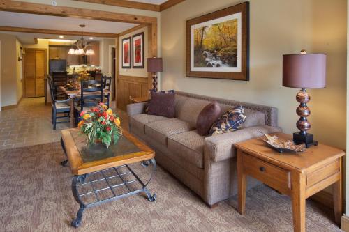 a living room with a couch and a table at Holiday Inn Club Vacations Smoky Mountain Resort, an IHG Hotel in Gatlinburg