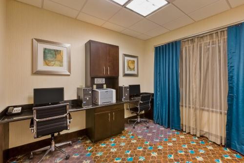 an office with desks and chairs and blue curtains at Holiday Inn Express and Suites Alpine by IHG in Alpine