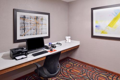 a room with a desk with a computer on it at Holiday Inn Express Hotel & Suites Lonoke I-40 by IHG in Lonoke
